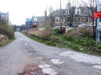 The remains of Merchiston station looking west in April 2002. The road along the former trackbed is now the eastern vehicle access to Slateford Yard. <br><br>[John Furnevel 19/04/2002]