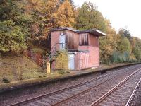 The disused Signal Box at Tomatin.The milepost indicates 99 miles from Perth.<br><br>[John Gray 14/10/2004]