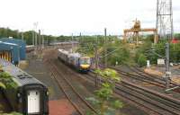 Glasgow - Edinburgh shuttle heads past the old Freightliner depot at Portobello on 9 July 2006 on its way to Waverley having been diverted around the sub due to line closure at Haymarket.<br><br>[John Furnevel 09/07/2006]