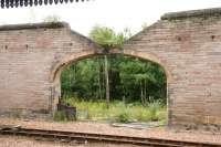Hole in the wall, Perth 2006, showing the abandoned and overgrown former locomotive stabling area beyond the west wall of Perth station. [See image 1569] <br><br>[John Furnevel 15/07/2006]