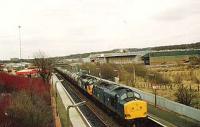 37012/044 reach the top of Cumbernauld bank  with a train of empty tanks for Bowling Harbour.<br><br>[Brian Forbes /01/1983]