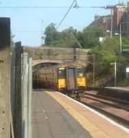 A class 318 Glasgow bound train departs from Johnstone Station<br><br>[Graham Morgan 12/09/2006]