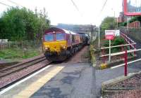 66115 about to pass through Johnstone heading for Hunterston with empty coal hoppers<br><br>[Graham Morgan 03/10/2006]
