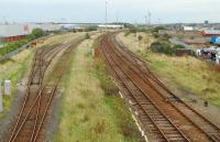 Looking north to Workington station over the now silent yard. The sidings to the left held the loaded trains of rails.<br><br>[Ewan Crawford 27/09/2006]