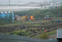 Equipment being unloaded at the former carriage sidings at Cowlairs. Note some site clearance has taken place.<br><br>[Ewan Crawford 17/10/2006]