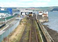 View over Stranraer Harbour on a Sunday morning in the summer of 2003 with a train at the platform.<br><br>[John Furnevel 17/08/2003]