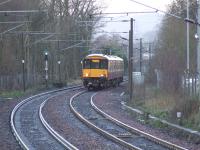 318258 heading up the hill on the approach to Johnstone station<br><br>[Graham Morgan 09/01/2007]