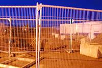 [Low quality shot] Behind the fence is the site of works at Raiths Farm. Earthmoving equipment and portacabins present.<br><br>[Ewan Crawford 27/01/2007]