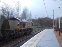 66020 racing through Johnstone station with coal empties heading for Hunterston.<br><br>[Graham Morgan 27/02/2007]