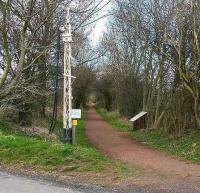 Looking northwest from the crossing at the former Saltoun station on the Gifford branch in March 2007. The old signal post points the way along the railway walk - information board on the right.<br><br>[John Furnevel 24/03/2007]