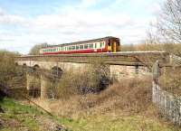 A Glasgow Central - Whifflet train crossing Clydebridge viaduct in April 2007 on the approach to Carmyle station.<br><br>[John Furnevel 22/04/2007]