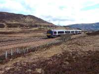 First Scotrail 170 unit goes over the summit, busy (as usual) A9 in background.<br><br>[John Gray 10/04/07]