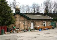 <I>The little house in Station Brae.</I> Sitting behind trees, in a small yard, off a busy road stands the old Portobello station house. The former island platform was reached via a subway through the embankment in the background, once accessible from both sides of the line. [See image 14165]<br><br>[John Furnevel 10/04/2007]