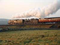 The sun lights up 60009 & 61994 as they leave Tomatin with <I>The Great Britain</I> and head for Findhorn Viaduct.<br><br>[John Gray 14/04/2007]