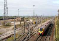 View north over Carlisle Kingmoor yard in April 2007 with a Voyager heading north on the WCML.<br><br>[John Furnevel 18/04/2007]