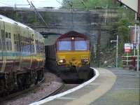 66236 thundering through Johnstone station with coal empties for Hunterston<br><br>[Graham Morgan 25/04/2007]