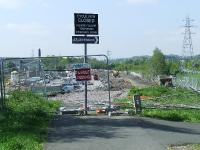 <i>End of the line?</i> The trackbed at North Johnstone comes to an abrupt halt, the site for the almost complete <i>Morrison</i> superstore taking its place. The original Johnstone North station was located where the pylon to the right stands  <br><br>[Graham Morgan 04/05/2007]