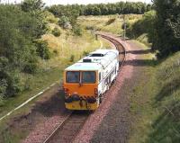 A track machine heads along the single line section of the <I>sub</I> between Niddrie West Junction and Brunstane on 25 May 2007. <br><br>[John Furnevel 25/05/2007]