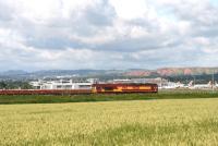 66236 with a ballast train in front of the terminal building at Edinburgh Airport on 8 July 2007 with a memento of the former West Lothian shale oil industry standing in the background. <br><br>[John Furnevel 08/07/2007]