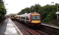 A Grahamston - Queen Street train arrives at Cumbernauld on 18 August, just as a terminating service from Motherwell heads for the reversing siding.<br><br>[David Panton 18/08/2007]