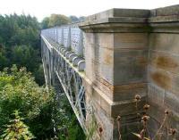 Looking south towards Roslin across the 1892 Bilston Glen viaduct in October 2007. The viaduct is one of the earliest examples of steel box lattice girder construction, with a 135m span. The category A listed structure underwent major restoration during the 1990s and is now part of a walkway. [See image 33123]<br><br>[John Furnevel 04/10/2007]