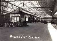 A postcard view of Princes Pier station, probably during the 1920s or 1930s, showing a scene typical of many stations at that time, with milk churns standing on the platform next to a van with an open door.<br><br>[A Snapper (Courtesy Bruce McCartney) //]