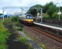 View west along the disused platform at Craigendoran on 4 August as a Helensburgh Central service commences the final leg of its journey.<br><br>[Ewan Crawford 04/08/2007]