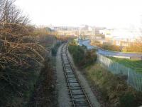 Looking north from the Bedford Road bridge over the Waterloo branch, with the site of Kittybrewster station just before the square building in the middle distance.<br><br>[John Williamson 17/12/2007]