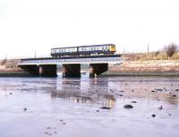 A class 108 DMU crossing Ravenglass Viaduct on the Cumbrian coast on a sunny 3 May 1990.<br><br>[Ian Dinmore 03/05/1990]