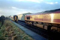 66095 with oil empties from Lairg waits for the northbound first service of the day at Muir of Ord.<br><br>[Ewan Crawford /02/2002]