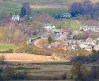 Looking north from Stirling Castle towards Bridge of Allan on 15 April 2008 with a container train about to pass through the station.<br><br>[John Furnevel 15/04/2008]