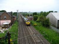 Southbound coal train passing the former Gretna station on 2 June behind a Freightliner class 66.<br><br>[John McIntyre 02/06/2008]