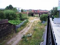 The remaining rails of the Longridge branch curve under the left hand bridge to join the WCML just to the north of Preston in this view west. From 1850 to 1885 there was a chord through the other bridges to directly access the line to Fleetwood and Blackpool but this was then removed and the line terminated in Maudlands Goods Yard, which remained open until around 1980. The goods yard site is now occupied by student halls of residence.  <br><br>[Mark Bartlett 05/07/2008]