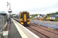 Work on the new platform and related infrastructure underway on the north side of the station at Uphall on 25 July 2008 as an eastbound 158 service arrives.<br><br>[John Furnevel 25/07/2008]
