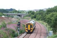 View west towards Livingston as an Edinburgh - Bathgate service passes the site of the former Bangour Junction on 18 August 2008.<br><br>[James Young 18/08/2008]