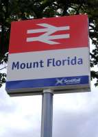New station signage at north entrance to Mount Florida station in August 2008. This is part of the agreement (including the new Saltire livery) announced by the Scottish government in April, that the First Scotrail franchise was to be extended to 2014. If you look closely the First Scotrail and SPT logos have gone... it now has the Saltire with the wording <I>ScotRail, Scotlands Railway</I>. <br><br>[Colin Harkins 23/08/2008]