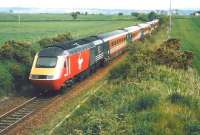 A southbound Virgin Trains 125 set approaching Usan signal box on the single line section from Montrose in June 1999.<br><br>[David Panton 27/06/1999]
