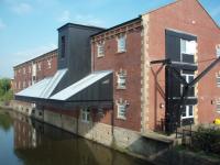 Not a railway building but who could resist this former canal warehouse. It is now Lomeshaye <I>(Lommashaw)</I> Medical Centre in Nelson and what a fantastic conversion. The consulting rooms are under the awning overlooking the water and many original features have been incoroprated such as the crane seen at the side. Once upon a time it would have been flattened and replaced with a concrete box. <br><br>[Mark Bartlett 26/09/2008]