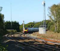 A pair of Voyagers emerging from under the wires of the WCML at Euxton Junction on 28 September and joining the route to Manchester via Chorley and Bolton. The service would normally have continued south down the WCML but was diverted via Manchester and Crewe due to engineering works. Euxton Junction had been singled some years ago but in 2006 double track running onto the Chorley line was restored.<br><br>[John McIntyre 28/09/2008]