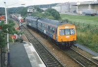 Unit 101 692 on the crossover from the reversing siding at Cumbernauld in July 1997 about to form the next service to Motherwell. The unit is in experimental ScotRail red, blue an gold livery. <br><br>[David Panton 12/Ju/1997]