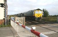 Having left the northbound ECML at Northallerton, Freightliner 66952 takes coal empties over the level crossing at Picton on 3 October, heading for Teesside. <br><br>[John Furnevel 03/10/2008]