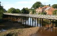 The bridge bringing the Whitby branch into Ruswarp, looking west along the River Esk on 2 October 2008.<br><br>[John Furnevel 02/10/2008]