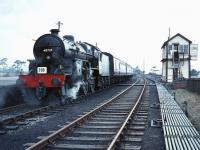 <I>Scottish Rambler No 3</I> stands at Symington on 29 March 1964 behind ex-LMS <I>Crab</I> 42737. The train had just returned from Broughton and 42737 had run round prior to taking the train south to Beattock.<br><br>[Robin Barbour Collection (Courtesy Bruce McCartney) 29/03/1964]