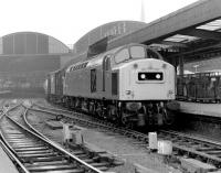 A class 40 brings a lengthy freight through Newcastle Central on a grey day in 1983.<br><br>[Colin Alexander //1983]