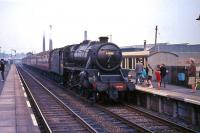 Black 5 no 44698 arrives at Cumbernauld station in August 1965 with a train for Glasgow.<br><br>[G W Robin 03/08/1965]