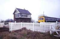 A DMU passing the signal box and level crossing alongside the closed station of St James Deeping in 1991. The train is on the former GN line between Peterborough and Spalding.<br><br>[Ian Dinmore //1991]
