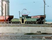 With the North Sea breaking gently on the shoreline in the background, NCB No 9 (German built AEG 1565 of 1913) stands with a train in the yards of Westoe Colliery, South Shields in 1983. Westoe was the last of the Tyneside pits to close 10 years later and No 9 is now in preservation on the Tanfield Railway. <br><br>[Colin Alexander //1983]