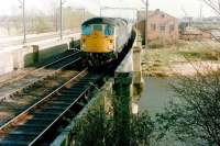 A Class 26 crosses the River Eden at Etterby shortly after leaving Carlisle in 1983 with a train for Glasgow Central via the G&SW route.<br><br>[Colin Alexander //1983]