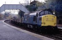 The then daily monotony of Class 303/311 EMUs is relieved at Patterton by a PW train on November 18th 1984. Leading is 37146 with 37056 at the rear. Repairs were underway at a bridge on the Neilston side of the station.<br><br>[Mark Dufton 18/11/1984]