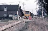The line between King's Lynn and Dereham was closed on September 9th 1968, but freight activity continued on short sections at either end. Shown here is the King's Lynn end at Middleton Towers, the first station out. This section of the line was (and is) retained for sand traffic from British Industrial Sand's transfer sidings just beyond the station. On March 29th 1980, a DMU is paying a visit as part of a west Norfolk freight lines rail tour. Apart from the absence of a signal box and signals, a photo taken at the same place in 1968 during the last days of passenger service would be little different.<br><br>[Mark Dufton 29/03/1980]